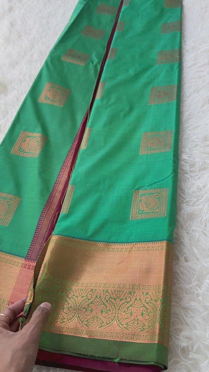 The Harmony Emerald Green Semi Silk Saree  With Meroon Border